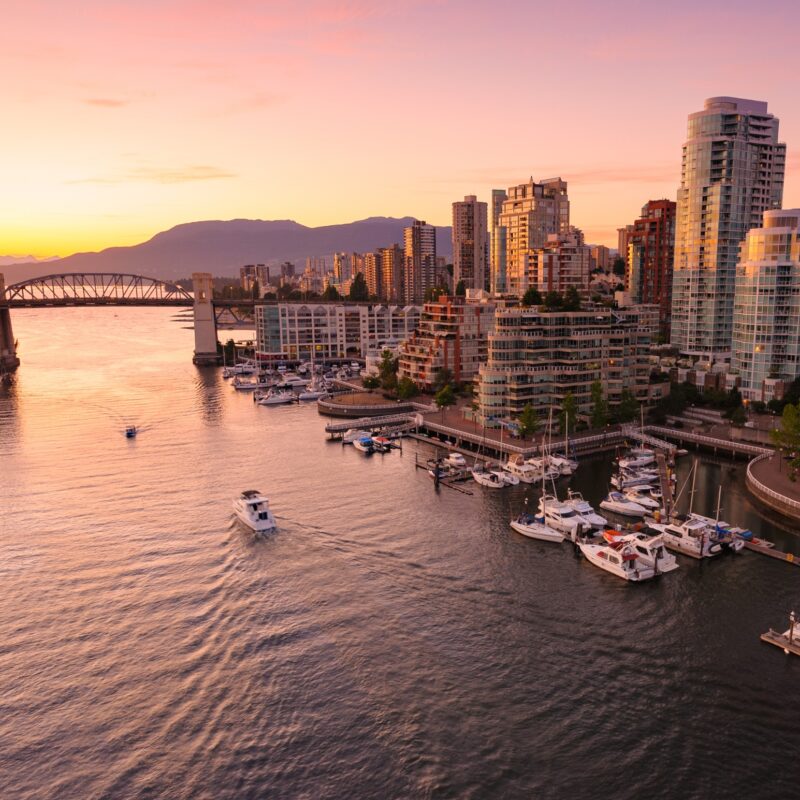 Photo at sunset of Vancouver city skyline overlooking the ocean