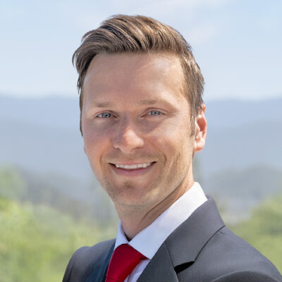 Headshot of Andreas Bogner, Founder and CEO, in front of an exterior background.