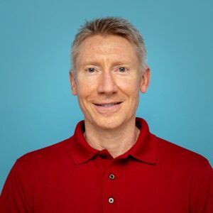 Headshot of Ray Tylak, Production Director, smiling at the camera.