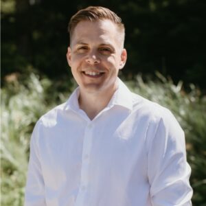 Headshot of Shawn Johnston, Founder and CEO of Refoundry, smiling against an outdoor background.